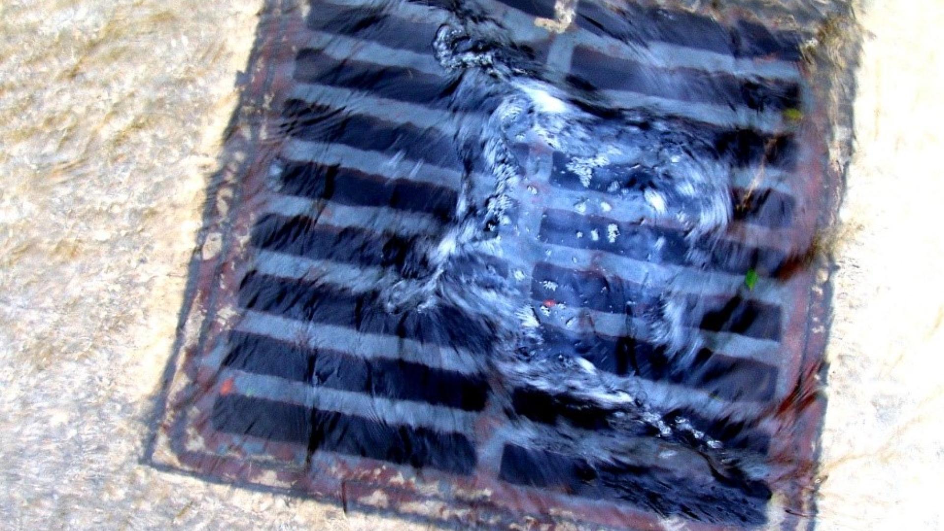 Water heads down a stormwater drain.
